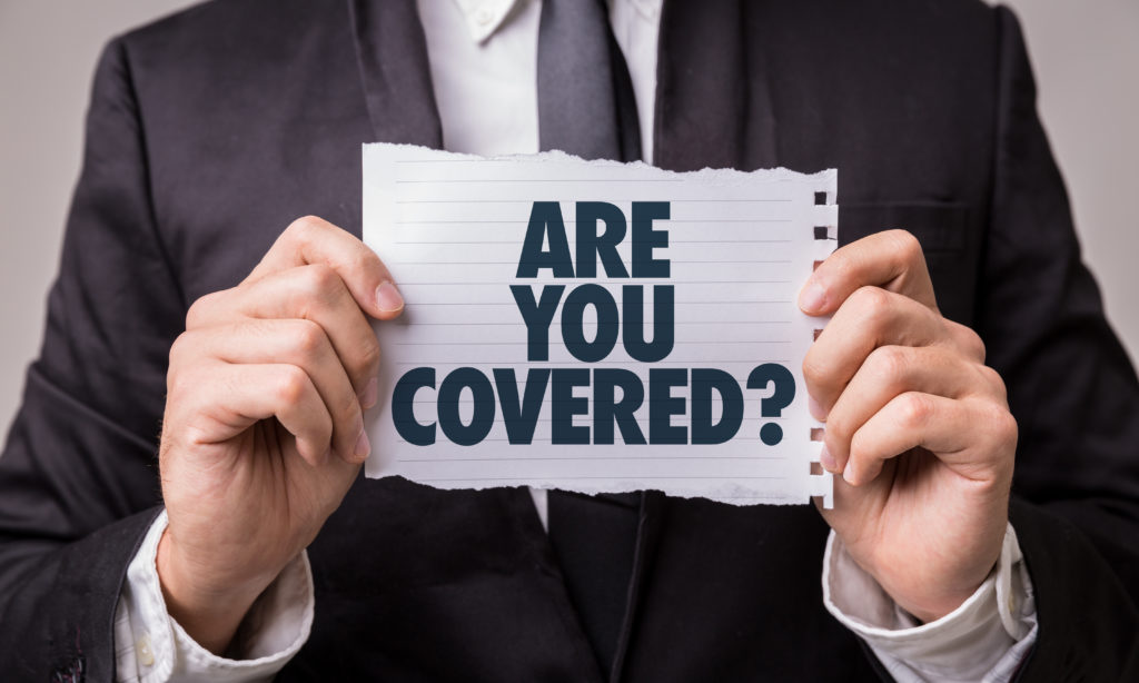 man holding paper asking are you covered in reference to personal injury protection